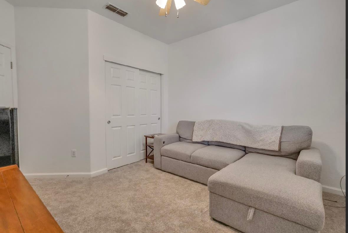 10647 Spring Creek Place Stockton, CA 95209 - Photo 14 of 24 a living room with furniture and a couch