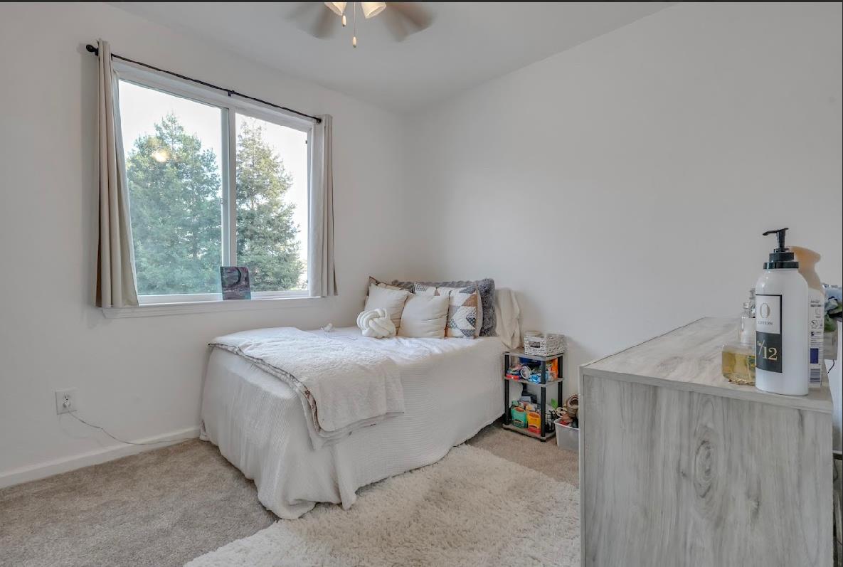 10647 Spring Creek Place Stockton, CA 95209 - Photo 19 of 24 a bed room with a bed and a window