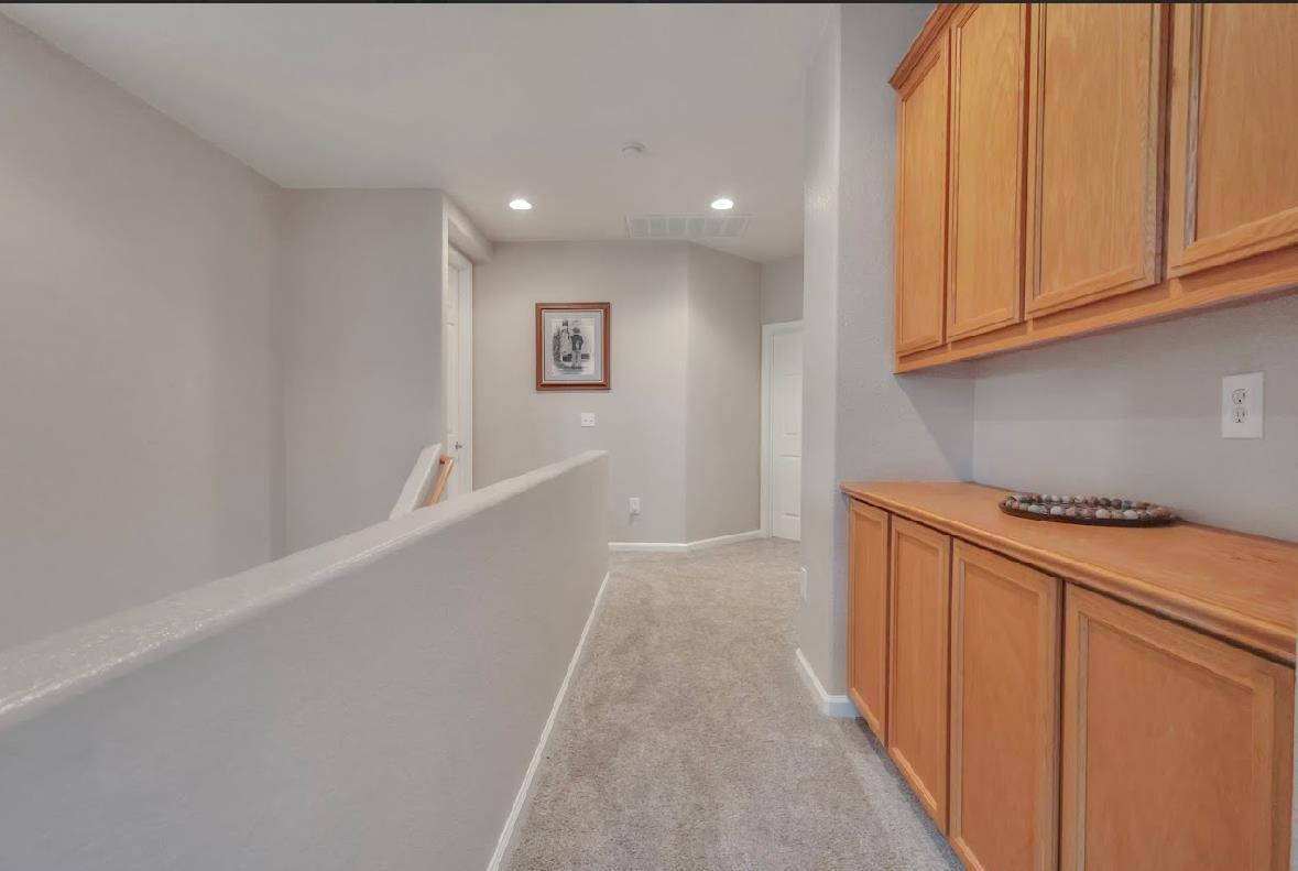10647 Spring Creek Place Stockton, CA 95209 - Photo 20 of 24 a view of a kitchen with stainless steel appliances granite countertop a refrigerator sink and cabinets
