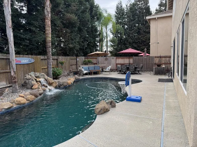a view of a chair and tables in the patio