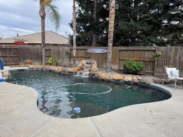 a view of a swimming pool with a patio