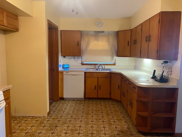 312 Walnut Street Leonore, IL 61332 - Photo 8 of 13 a kitchen with a sink cabinets and window