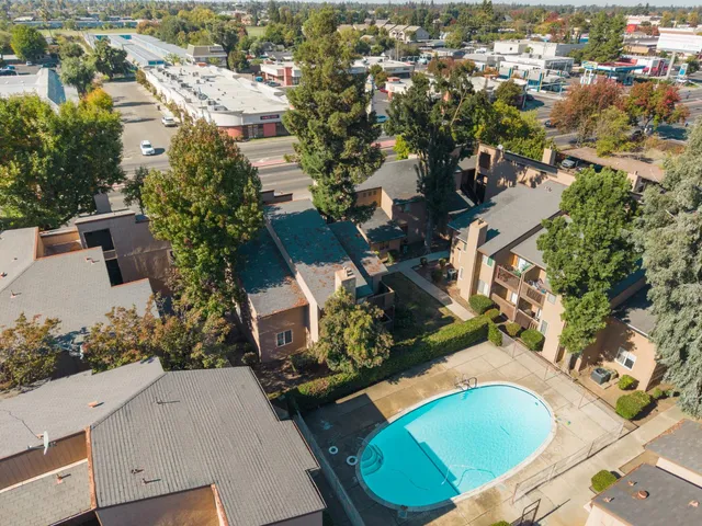 an aerial view of a house with a yard