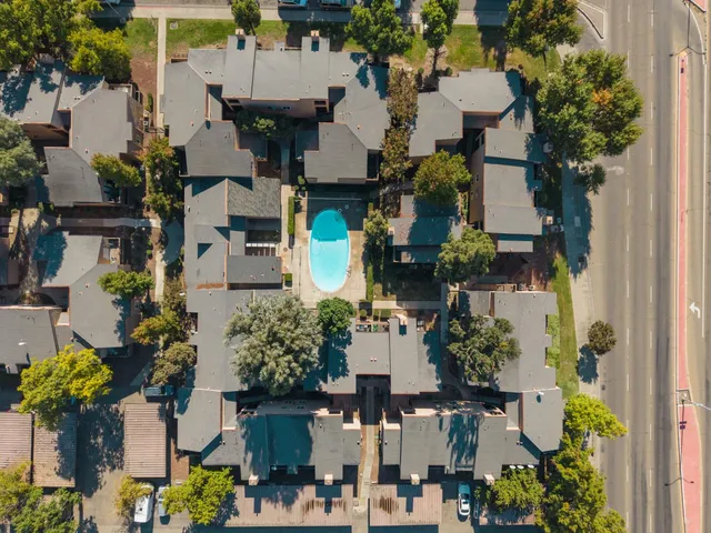 an aerial view of a house with swimming pool
