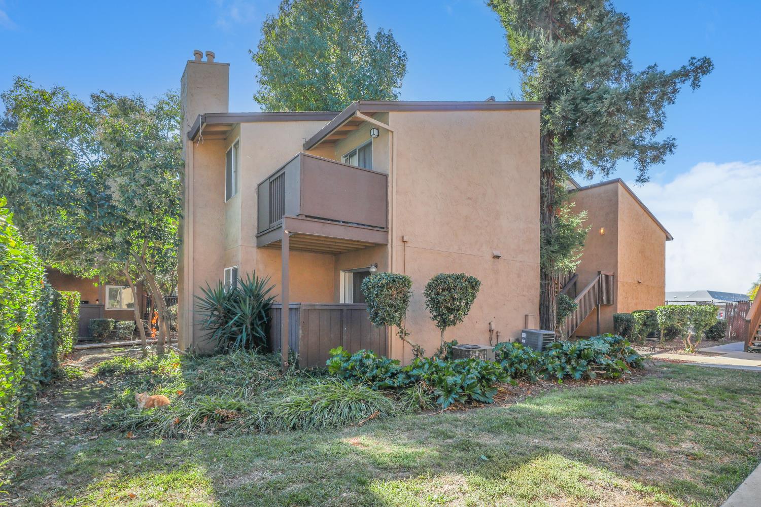 4332 Pacific Avenue, Unit 25 Stockton, CA 95207 - Photo 5 of 38 a view of a house with a yard and plants