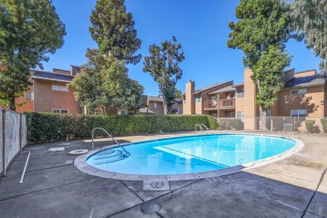 a view of a swimming pool with a patio
