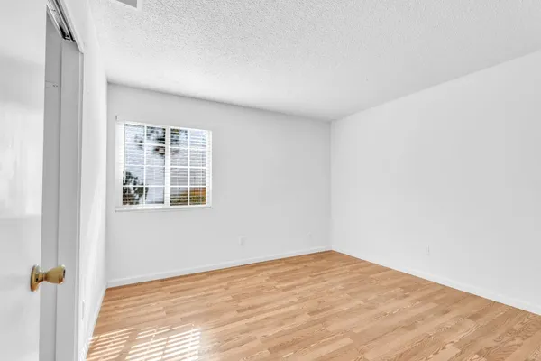 a view of empty room with windows