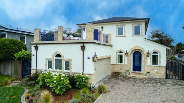 a front view of a house with a yard