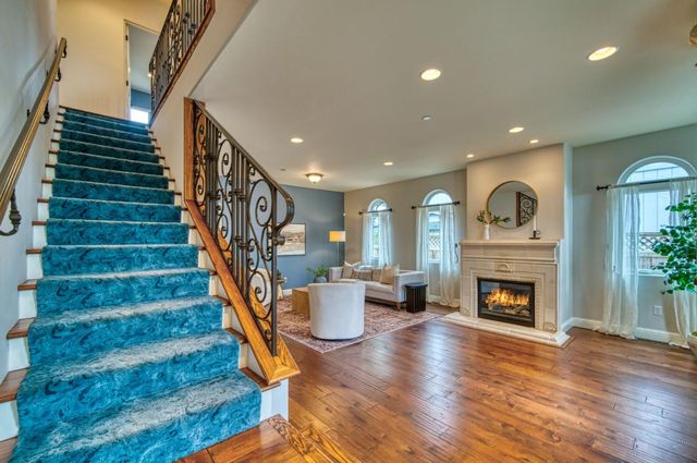 a bedroom with a bed and a fireplace