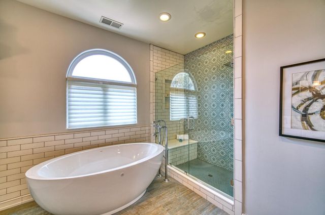 a balcony with furniture and wooden floor