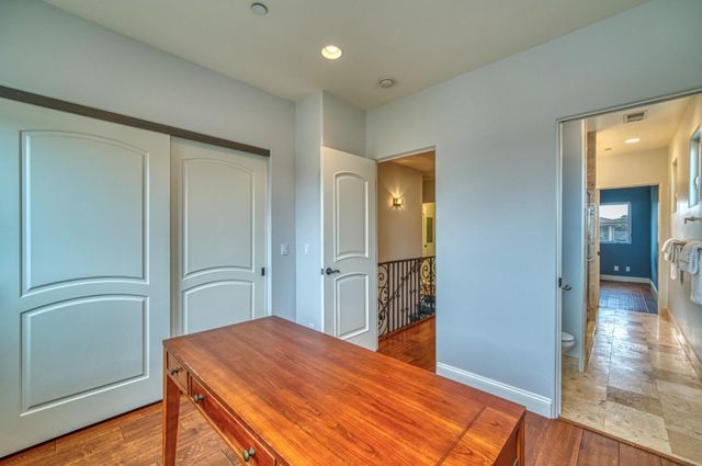 a backyard of a house with plants and outdoor seating