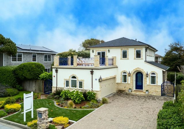 a front view of a house with yard porch and furniture