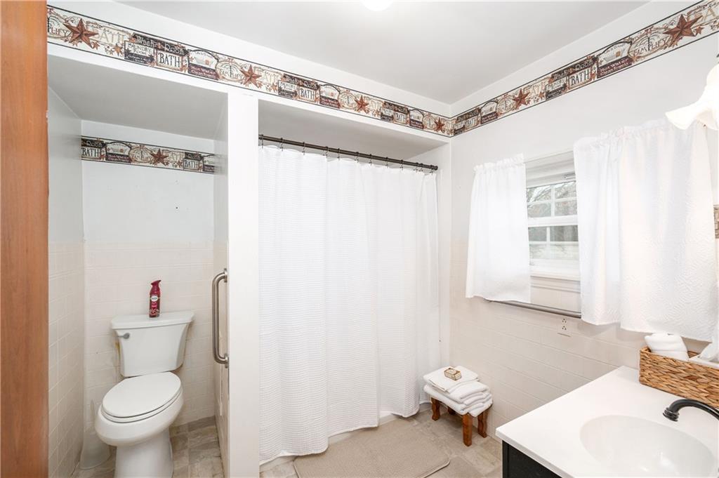 1080 Breakneck Bridge Road Portersville, PA 16051 - Photo 22 of 45 a bathroom with a sink toilet and shower