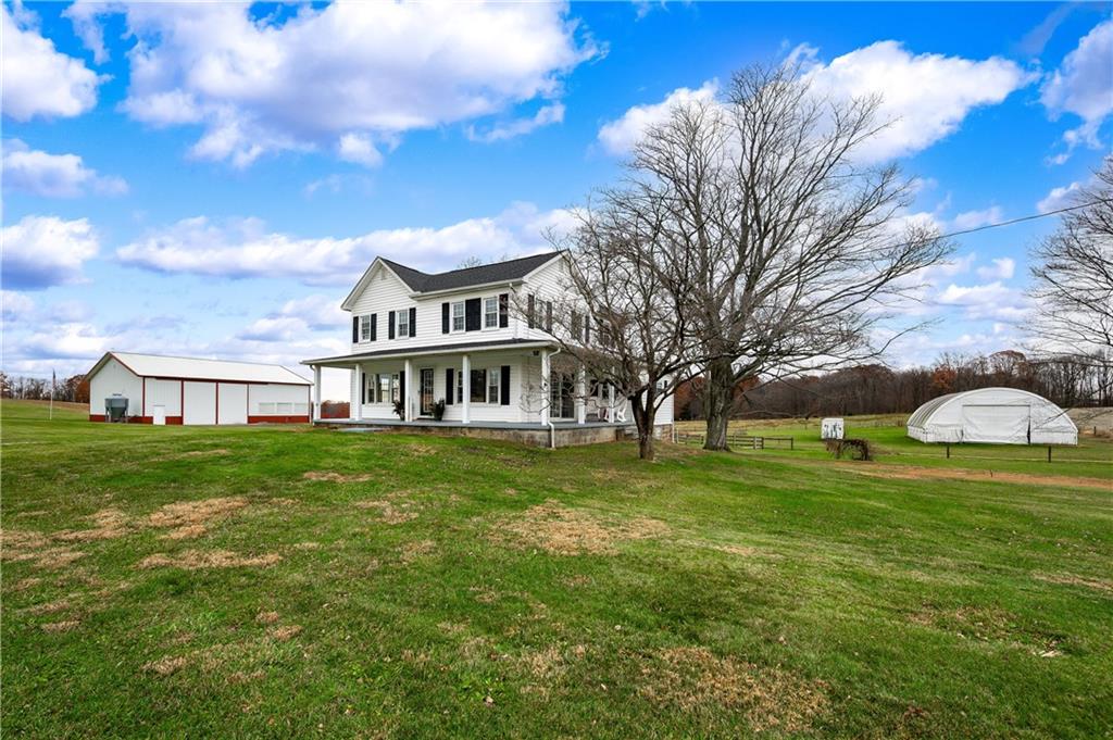 1080 Breakneck Bridge Road Portersville, PA 16051 - Photo 3 of 45 a front view of a house with a garden