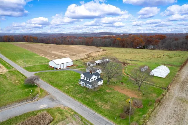 a view of a big yard with an outdoor seating