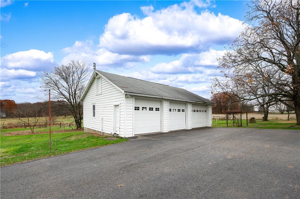 1080 Breakneck Bridge Road Portersville, PA 16051 - Photo 4 of 45 a view of a house with a big yard and large tree