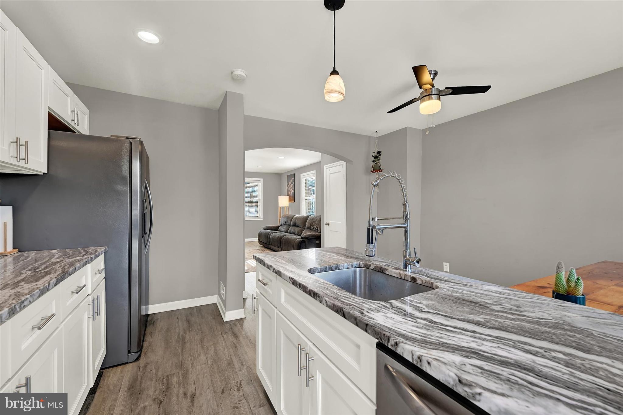 3482 Dunhaven Road Dundalk, MD 21222 - Photo 11 of 33 a kitchen with a sink a counter space appliances and cabinets