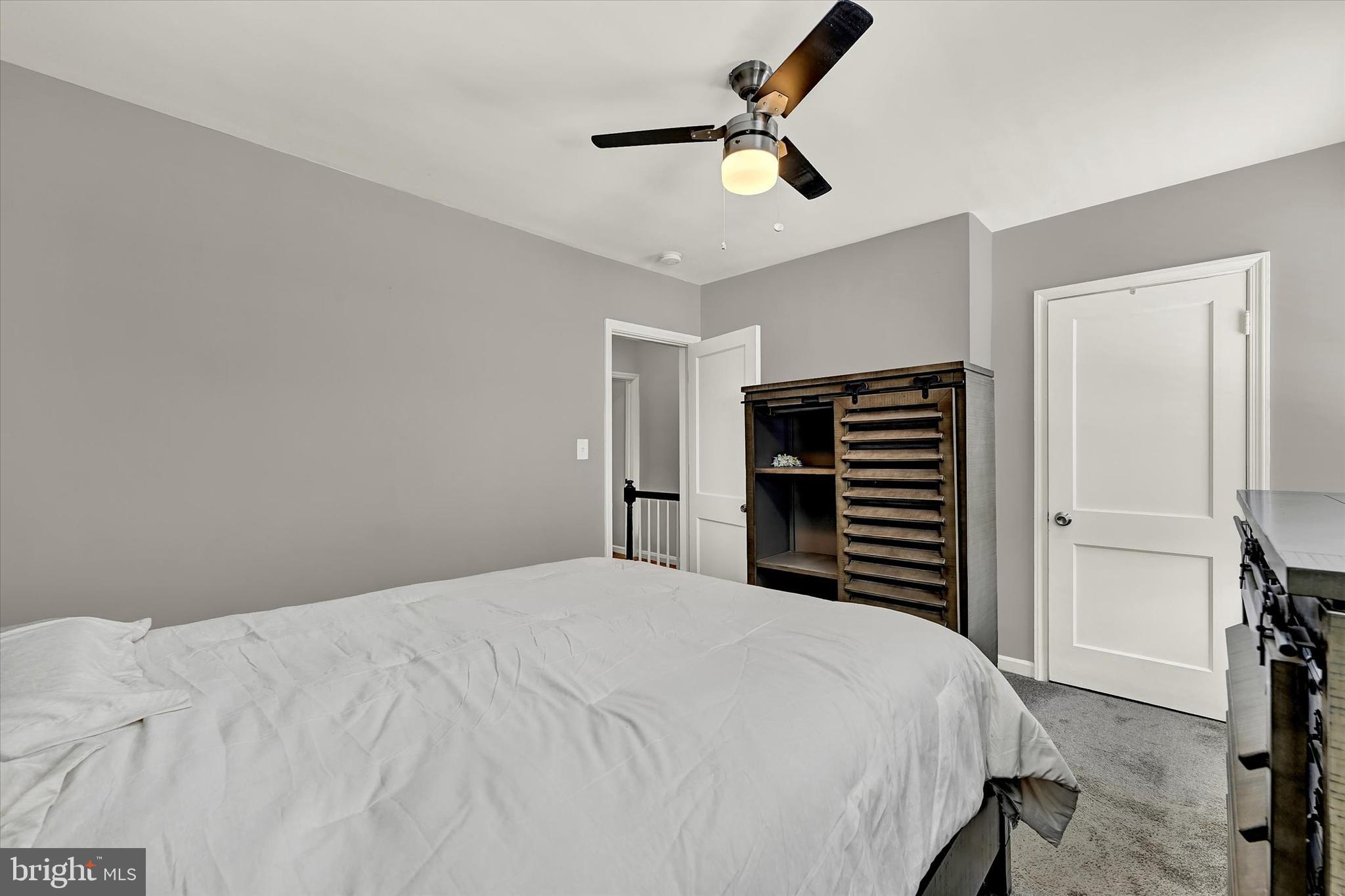 3482 Dunhaven Road Dundalk, MD 21222 - Photo 16 of 33 a bedroom with a bed and a chandelier