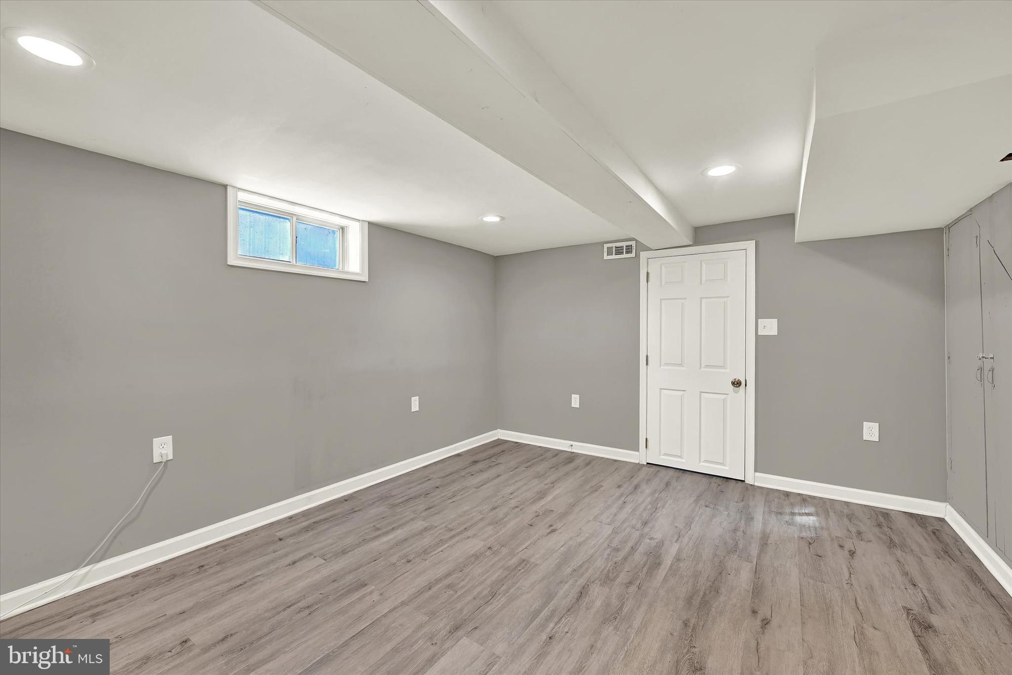 3482 Dunhaven Road Dundalk, MD 21222 - Photo 22 of 33 a view of an empty room with wooden floor