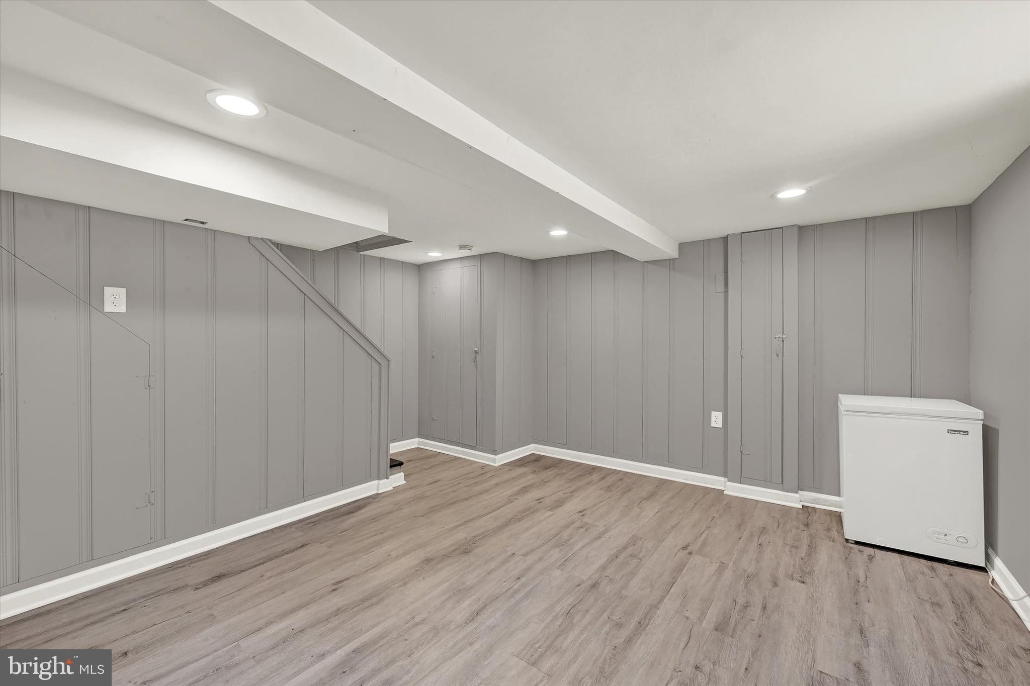 3482 Dunhaven Road Dundalk, MD 21222 - Photo 23 of 33 an empty room with wooden floor and windows