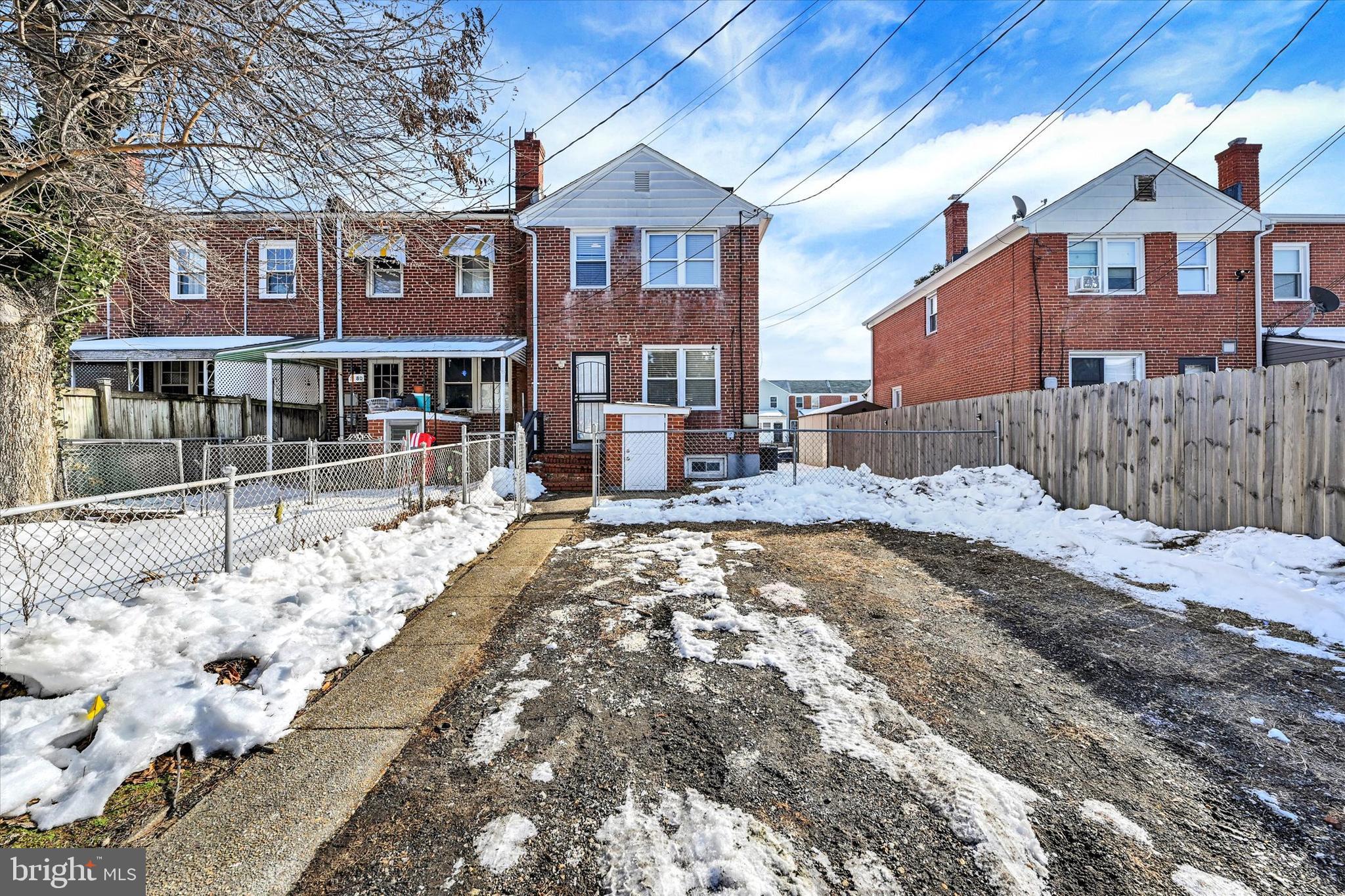 3482 Dunhaven Road Dundalk, MD 21222 - Photo 27 of 33 a front view of a house with a yard covered with snow