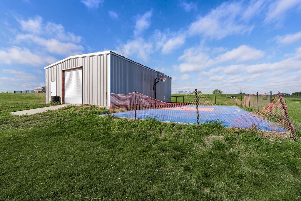 461 Pearson Ranch Road Azle, TX 76020 - Photo 38 of 40 The workshop and sports courts are great hobby spaces.