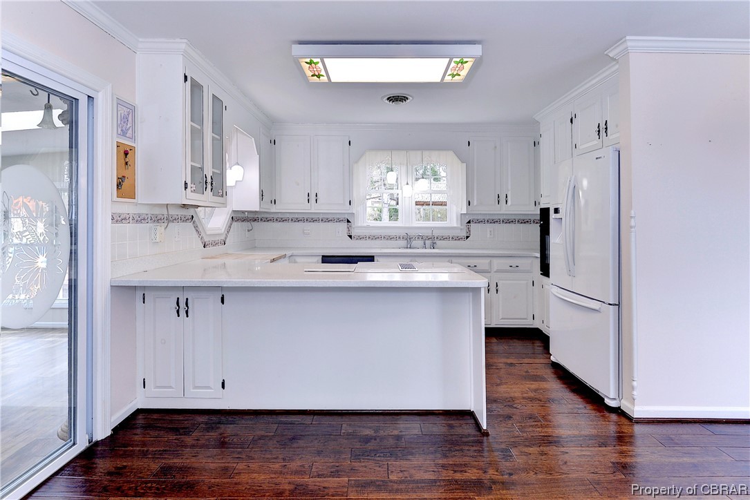 3159 Old Stage Road Toano, VA 23168 - Photo 10 of 44 Kitchen with modern appliances and beautiful floors. Sliding door to sunroom