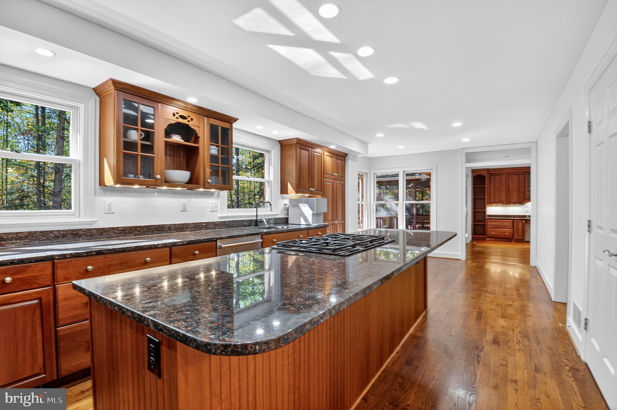 11813 Triple Crown Road Reston, VA 20191 - Photo 7 of 51 a large kitchen with kitchen island a large window in it