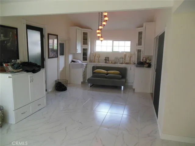 a view of a livingroom with furniture and windows