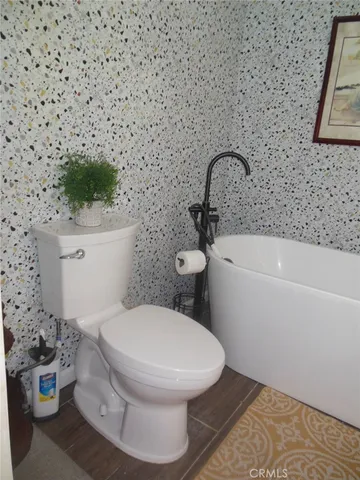 a bathroom with a toilet and a sink