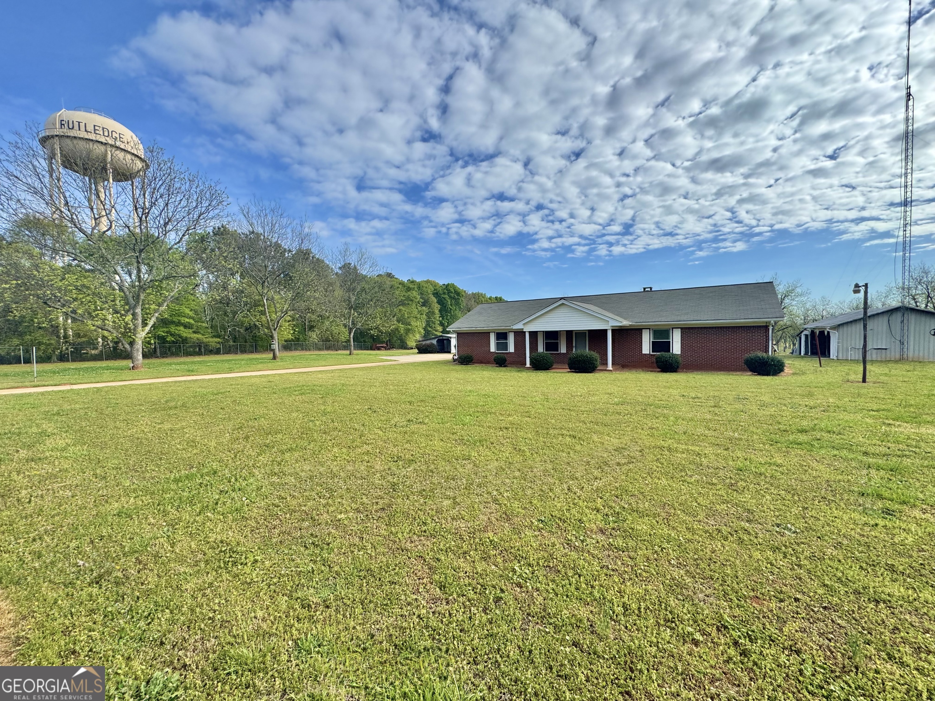 1760 Fears Road Rutledge, GA 30663 - Photo 1 of 68 a front view of a house with a garden