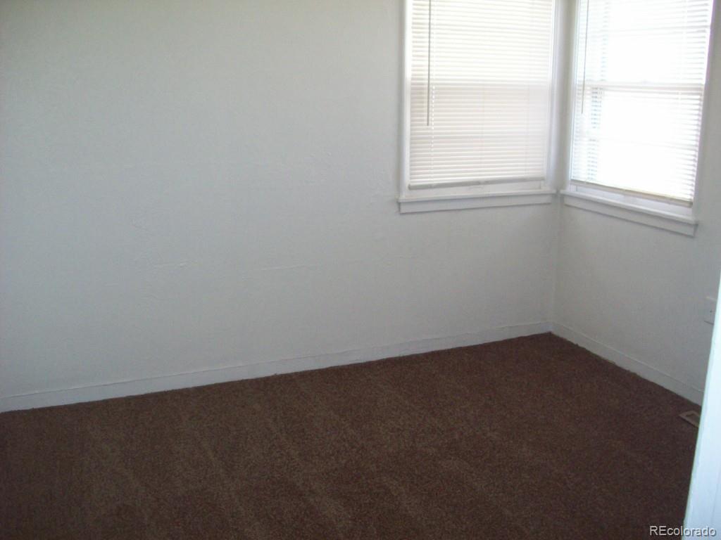1930 Ulster Street Denver, CO 80220 - Photo 7 of 9 an empty room with a window
