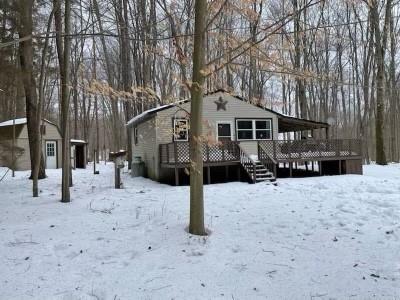 125 Deer Road Cochranton, PA 16314 - Photo 8 of 8 a front view of a house with a yard covered in snow