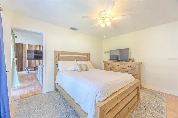 a bedroom with a bed and a chandelier