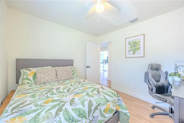 a bedroom with a bed and cabinets