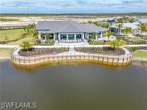 3987 Pegasus Way Naples, FL 34120 - Photo 8 of 8 a front view of a house with a lake view
