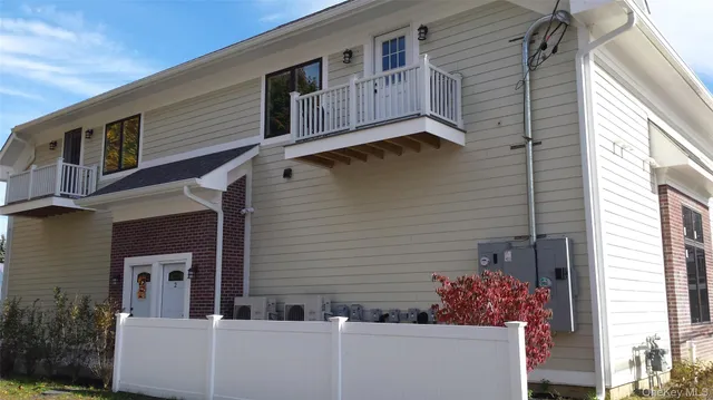 a view of a house with a potted plant