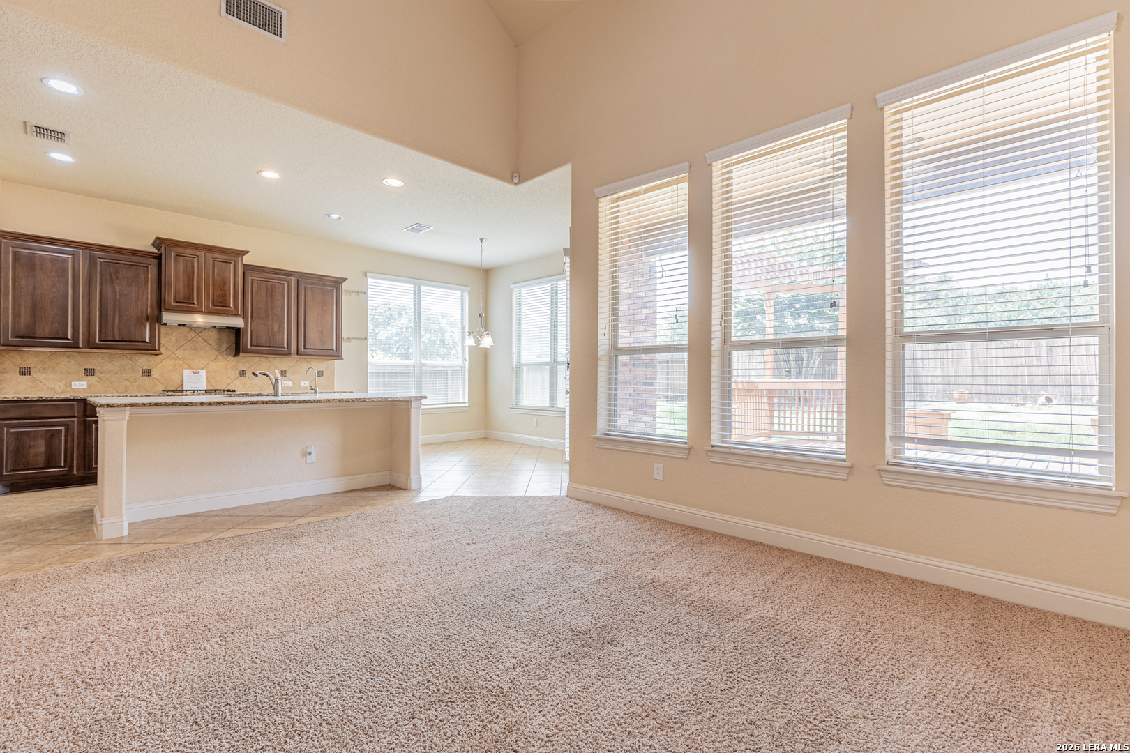 8103 Mystic Chase Boerne, TX 78015 - Photo 11 of 49 a view of kitchen with stainless steel appliances granite countertop a stove top oven a sink and a large window