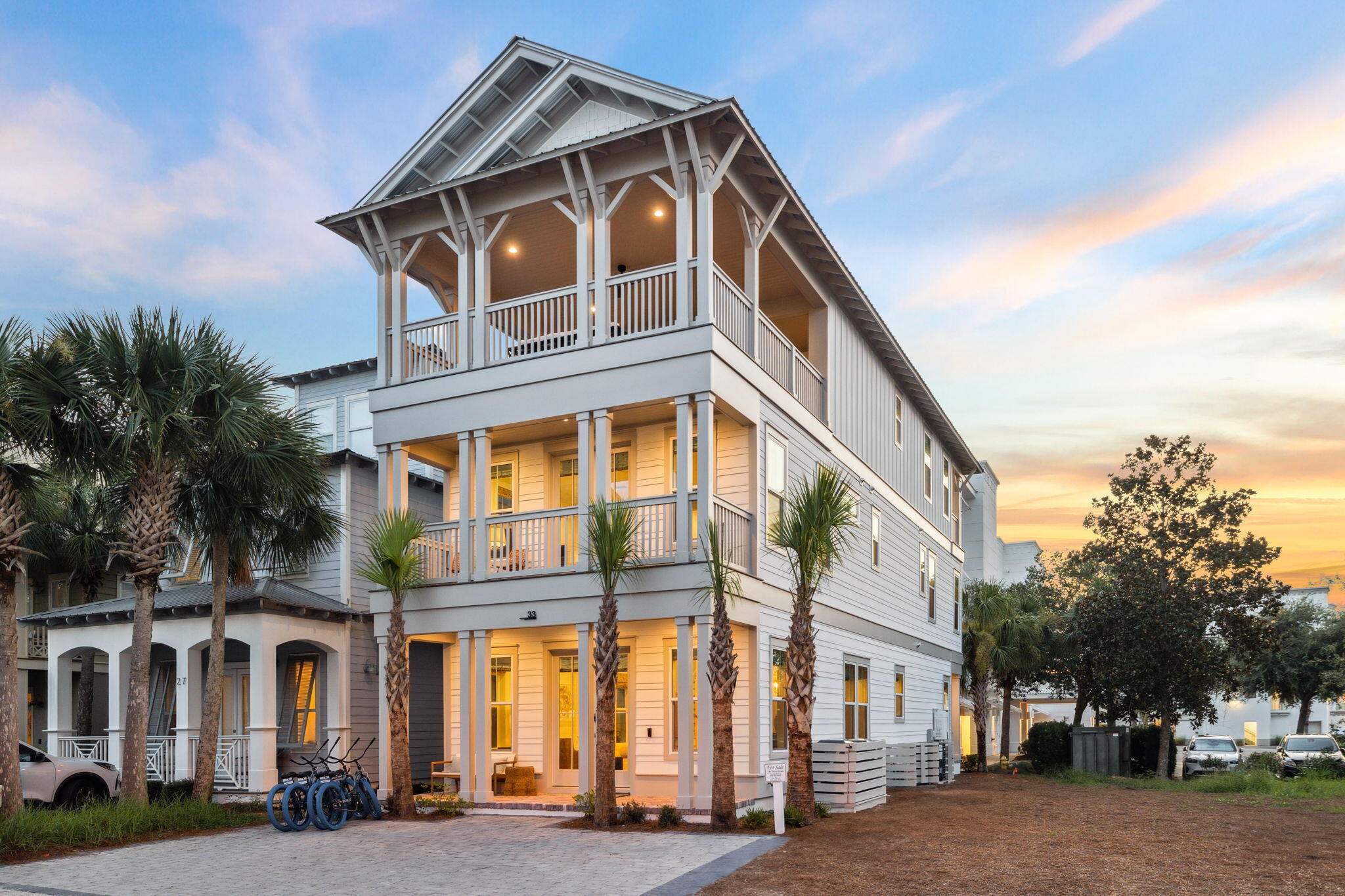 33 Sand Flea Dr Inlet Beach Inlet Beach, FL 32461 - Photo 1 of 56 a front view of a building with lot of cars and trees