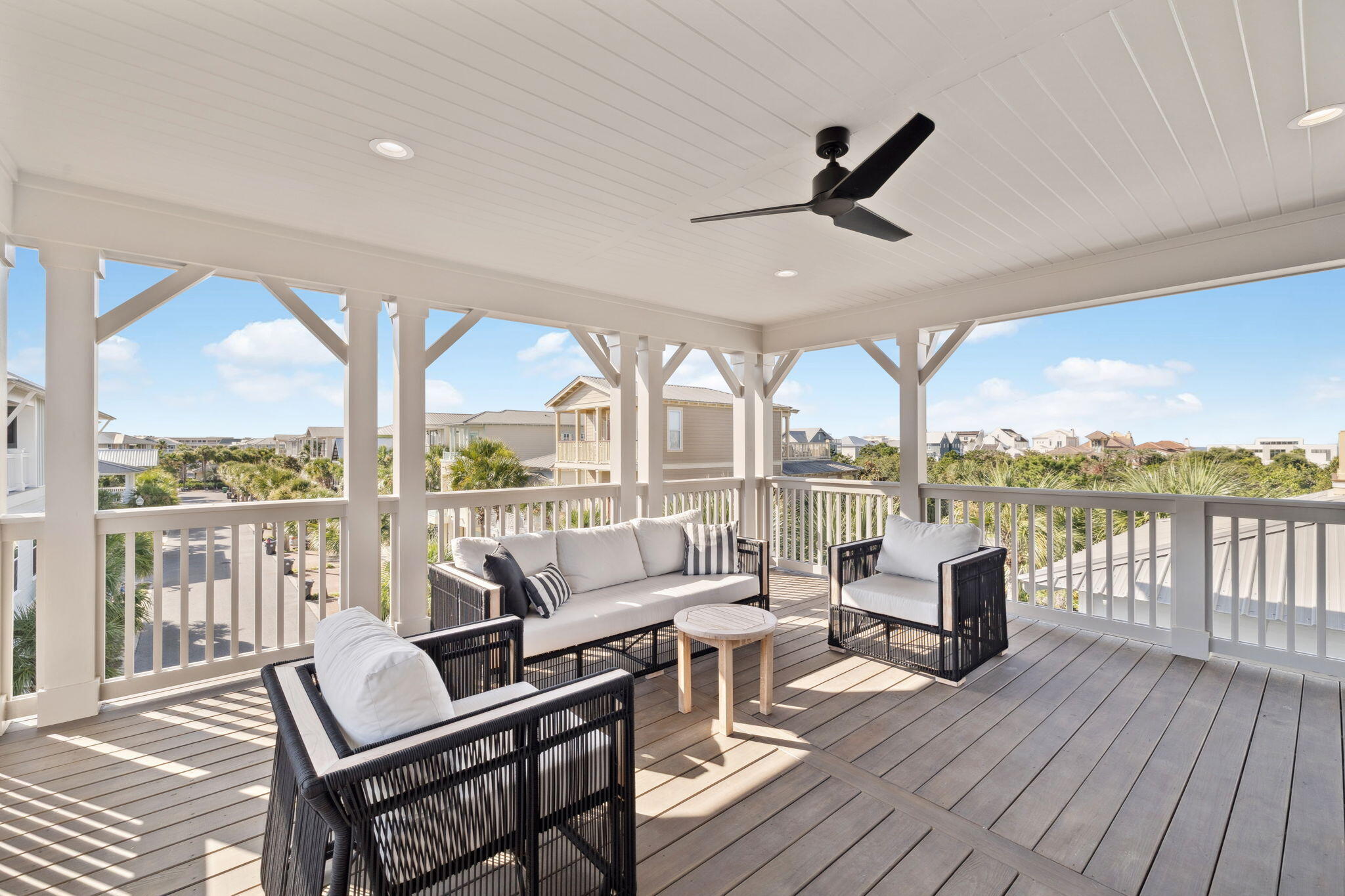 33 Sand Flea Dr Inlet Beach Inlet Beach, FL 32461 - Photo 42 of 56 a living room with furniture floor to ceiling windows and a table