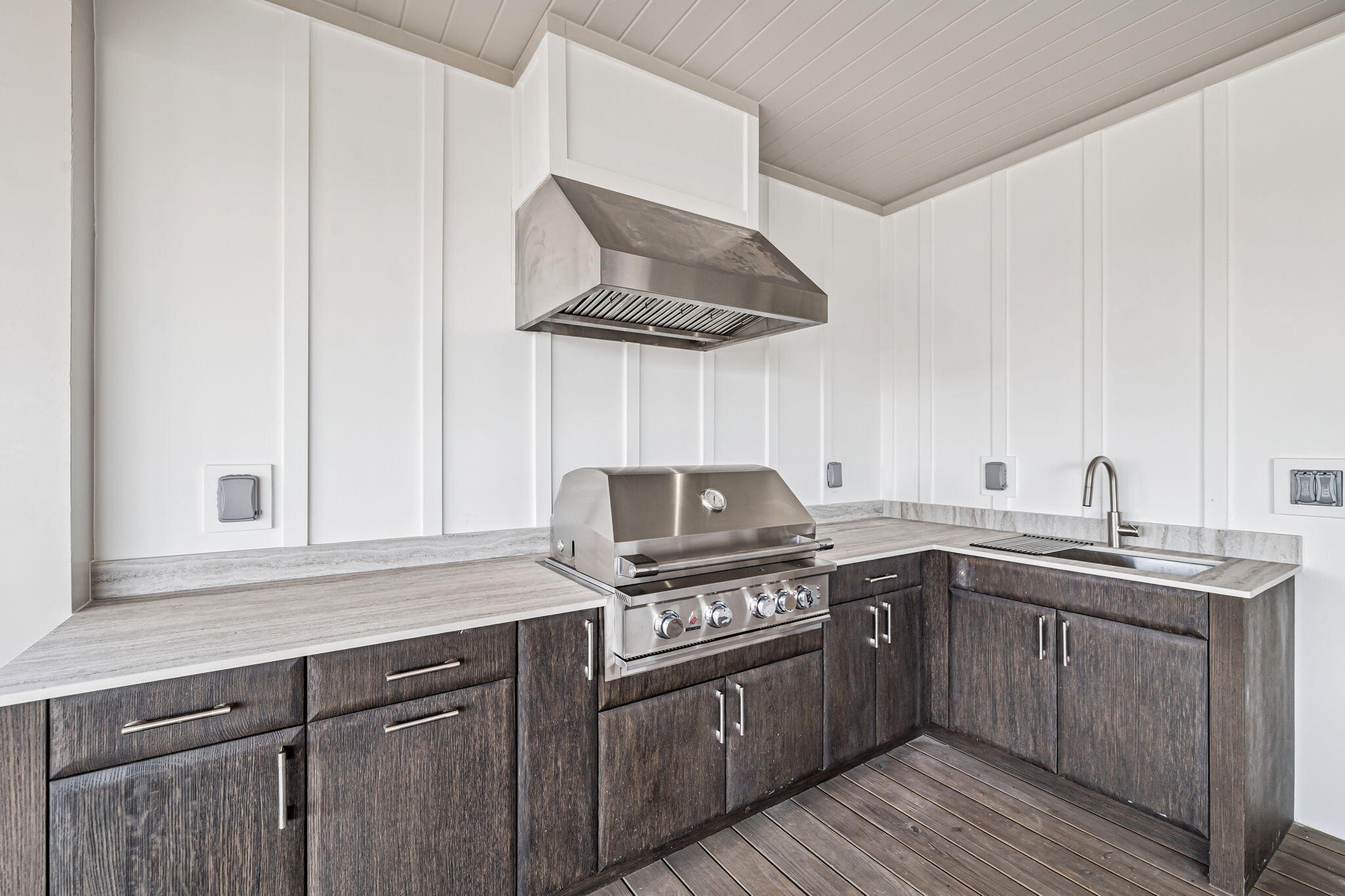 33 Sand Flea Dr Inlet Beach Inlet Beach, FL 32461 - Photo 45 of 56 a kitchen with stainless steel appliances a sink a stove and cabinets