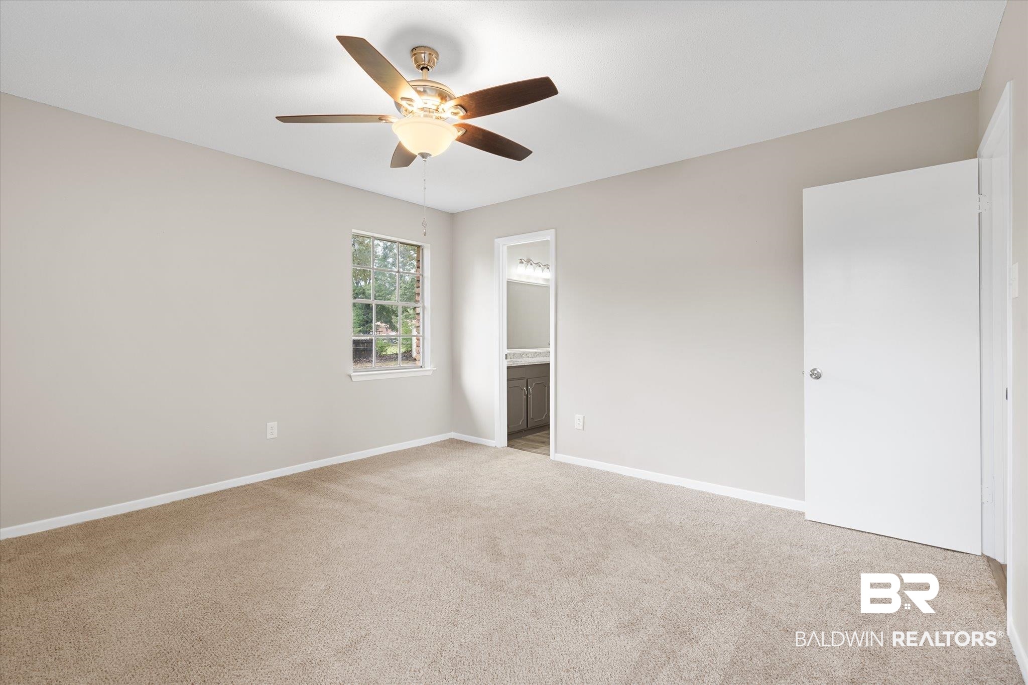 5015 Golfway Drive Eight Mile, AL 36613 - Photo 13 of 31 Unfurnished bedroom featuring ceiling fan, ensuite bathroom, and light colored carpet