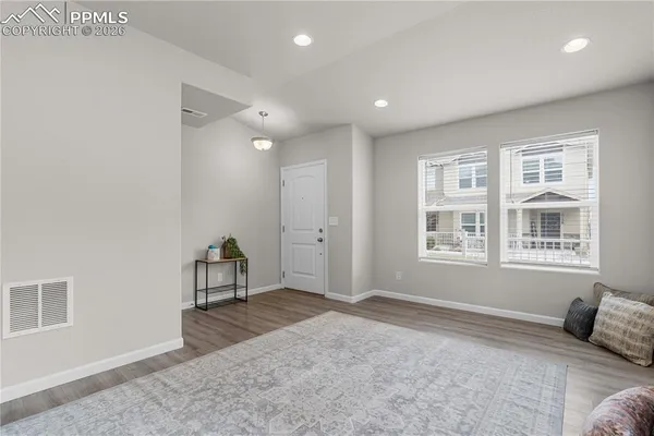 a bedroom with furniture and windows