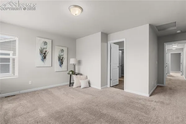 a view of an empty room and window