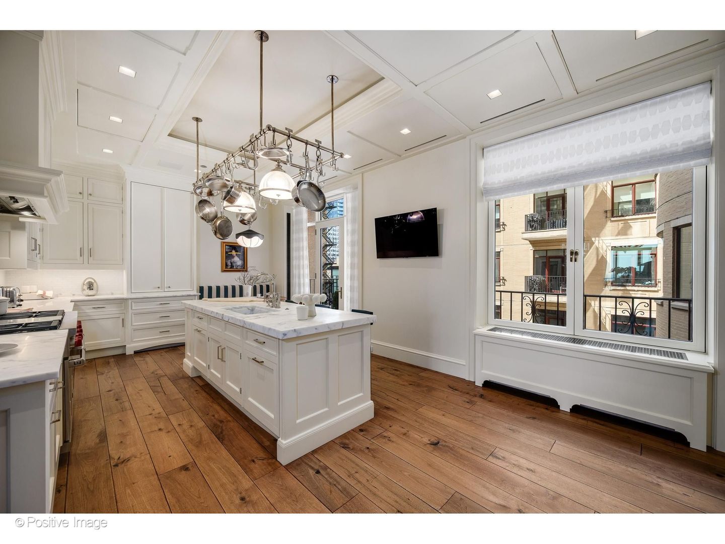 65 East Goethe Street, Unit 4E Chicago, IL 60610 - Photo 19 of 45 a living room with stainless steel appliances kitchen island furniture and a chandelier