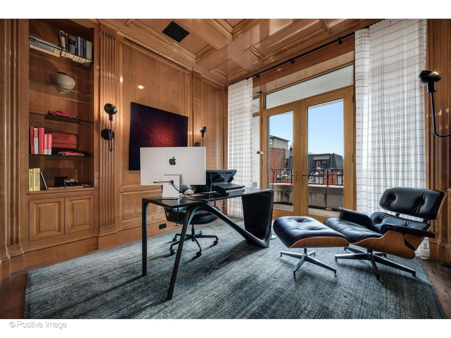 65 East Goethe Street, Unit 4E Chicago, IL 60610 - Photo 26 of 45 a living room with furniture a flat screen tv and a floor to ceiling window