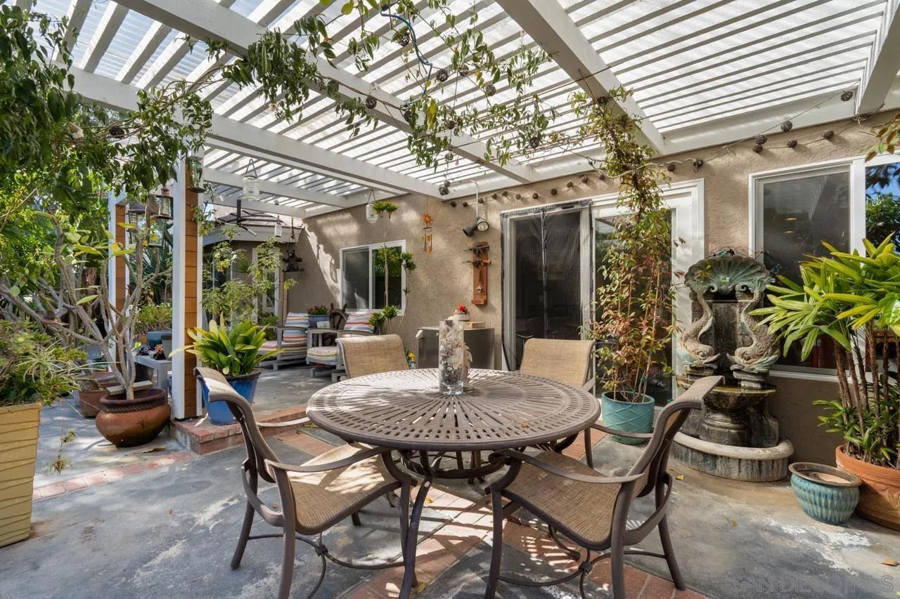 1815 Hawk View Drive Encinitas, CA 92024 - Photo 18 of 51 a view of a patio with a table and chairs