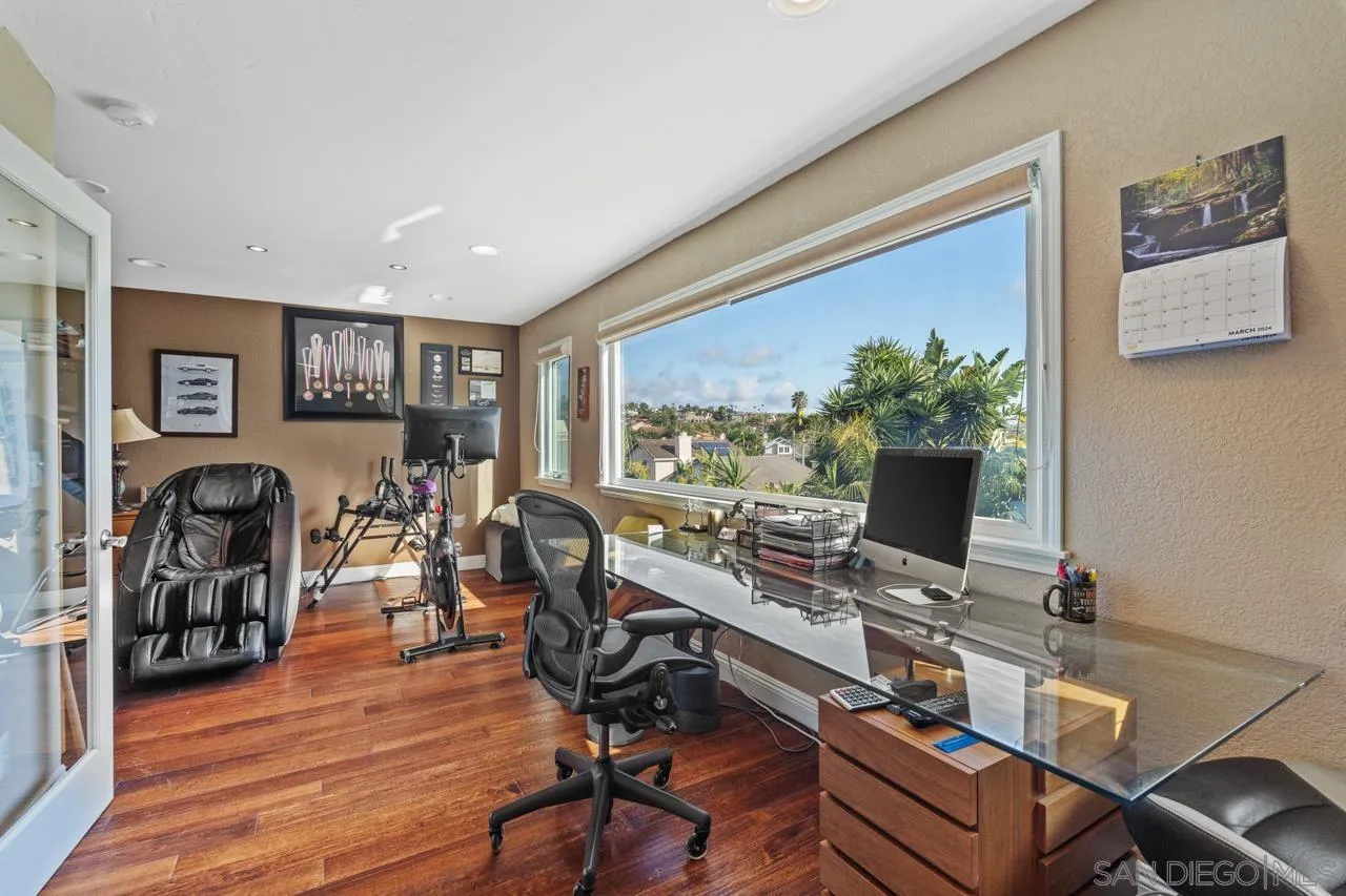1815 Hawk View Drive Encinitas, CA 92024 - Photo 27 of 51 a view of a workspace with furniture and a potted plant