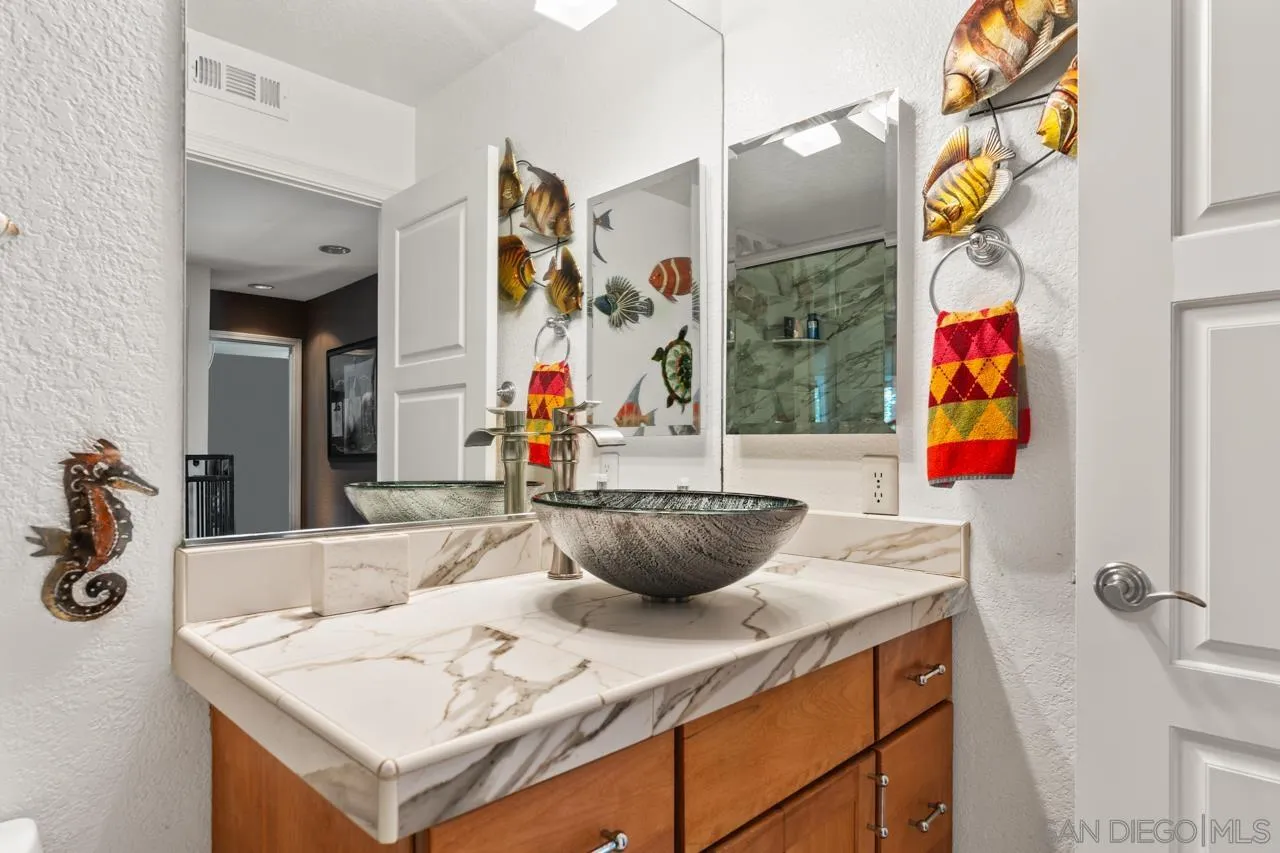 1815 Hawk View Drive Encinitas, CA 92024 - Photo 29 of 51 a kitchen with a sink a stove and a wooden floor