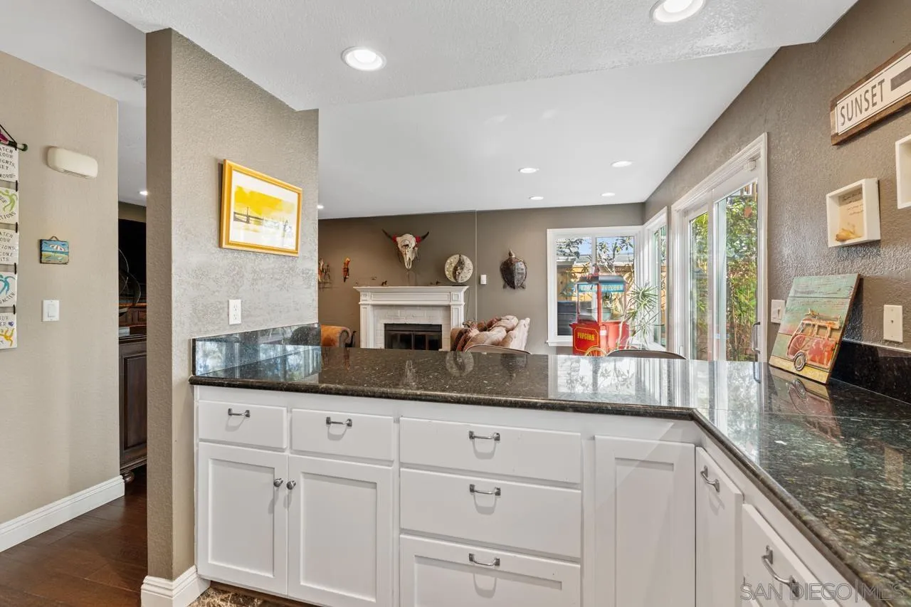 1815 Hawk View Drive Encinitas, CA 92024 - Photo 37 of 51 a kitchen with granite countertop a sink and cabinets